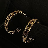 CHANEL Earrings Gold 21A CC Dangle Hoops Earrings Gold - Redeluxe