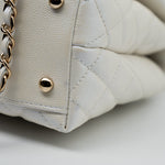 CHANEL Handbag 20K Iridescent White Caviar Quilted Coco Handle Medium Light Gold Hardware - Redeluxe