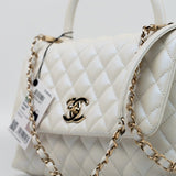 CHANEL Handbag 20K Iridescent White Caviar Quilted Coco Handle Medium Light Gold Hardware - Redeluxe