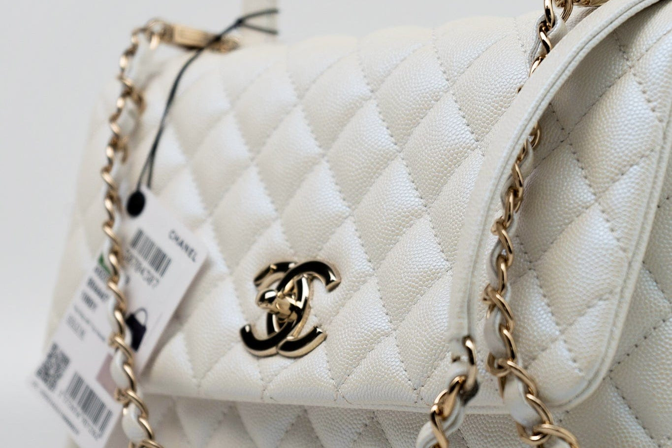 CHANEL Handbag 20K Iridescent White Caviar Quilted Coco Handle Medium Light Gold Hardware - Redeluxe