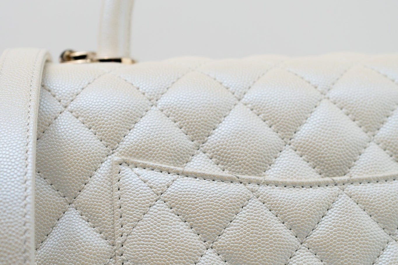 CHANEL Handbag 20K Iridescent White Caviar Quilted Coco Handle Medium Light Gold Hardware - Redeluxe