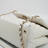 CHANEL Handbag 20K Iridescent White Caviar Quilted Coco Handle Medium Light Gold Hardware - Redeluxe