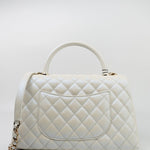 CHANEL Handbag 20K Iridescent White Caviar Quilted Coco Handle Medium Light Gold Hardware - Redeluxe