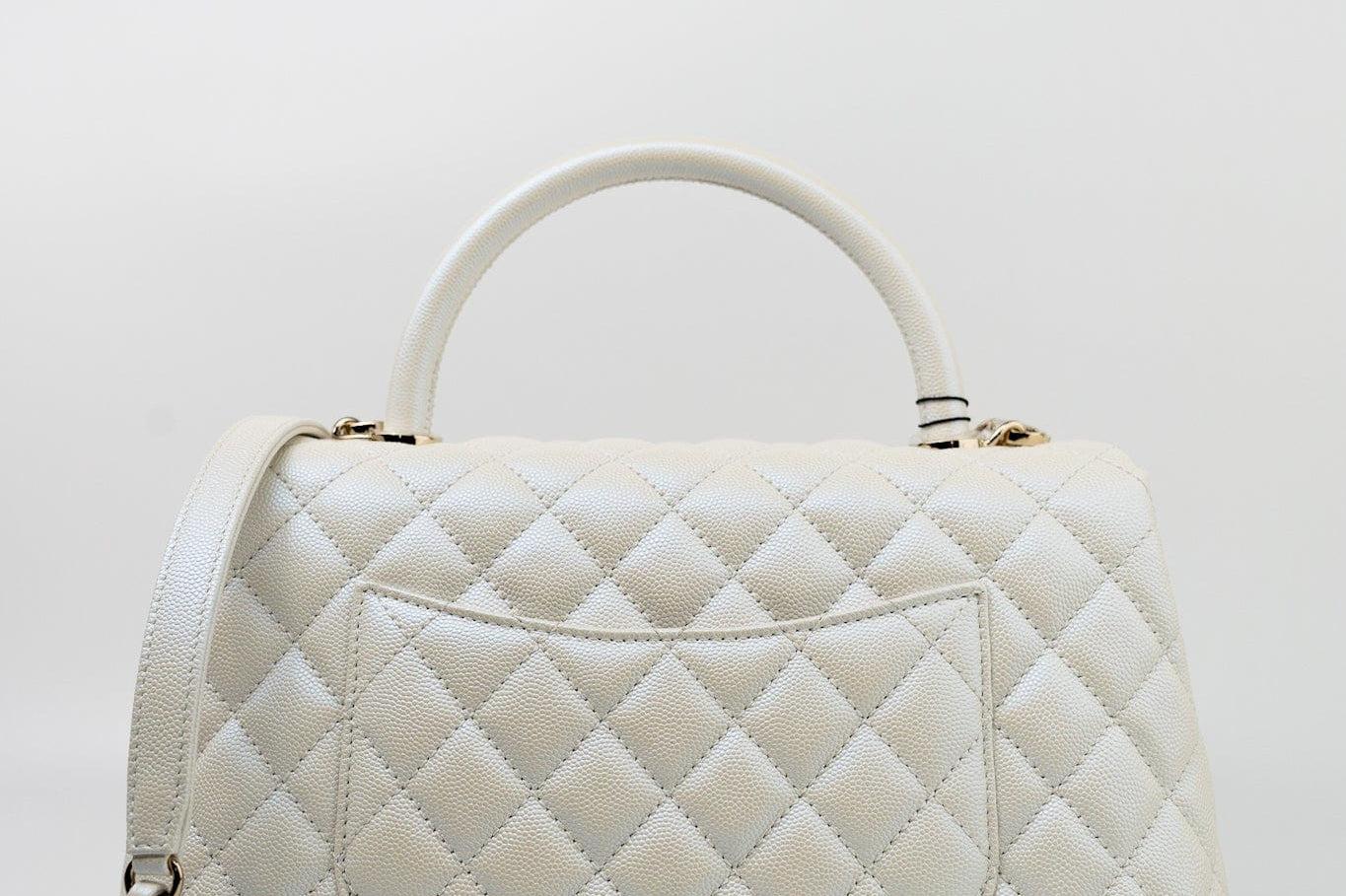CHANEL Handbag 20K Iridescent White Caviar Quilted Coco Handle Medium Light Gold Hardware - Redeluxe