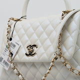 CHANEL Handbag 20K Iridescent White Caviar Quilted Coco Handle Medium Light Gold Hardware - Redeluxe