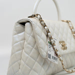 CHANEL Handbag 20K Iridescent White Caviar Quilted Coco Handle Medium Light Gold Hardware - Redeluxe