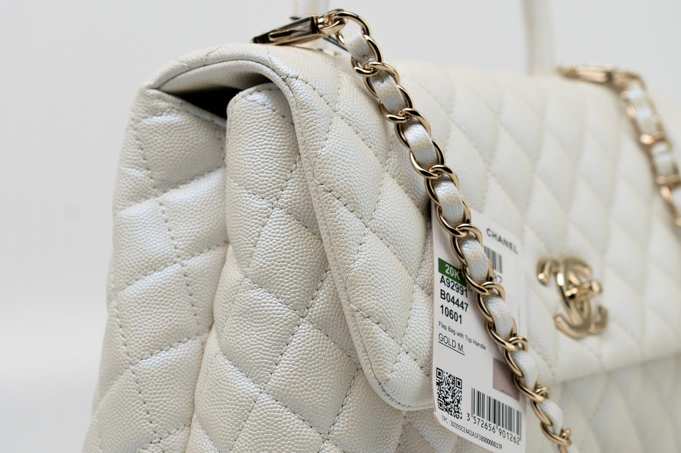 CHANEL Handbag 20K Iridescent White Caviar Quilted Coco Handle Medium Light Gold Hardware - Redeluxe