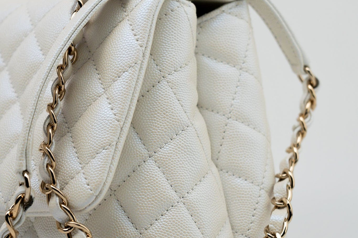 CHANEL Handbag 20K Iridescent White Caviar Quilted Coco Handle Medium Light Gold Hardware - Redeluxe