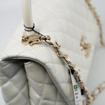CHANEL Handbag 20K Iridescent White Caviar Quilted Coco Handle Medium Light Gold Hardware - Redeluxe