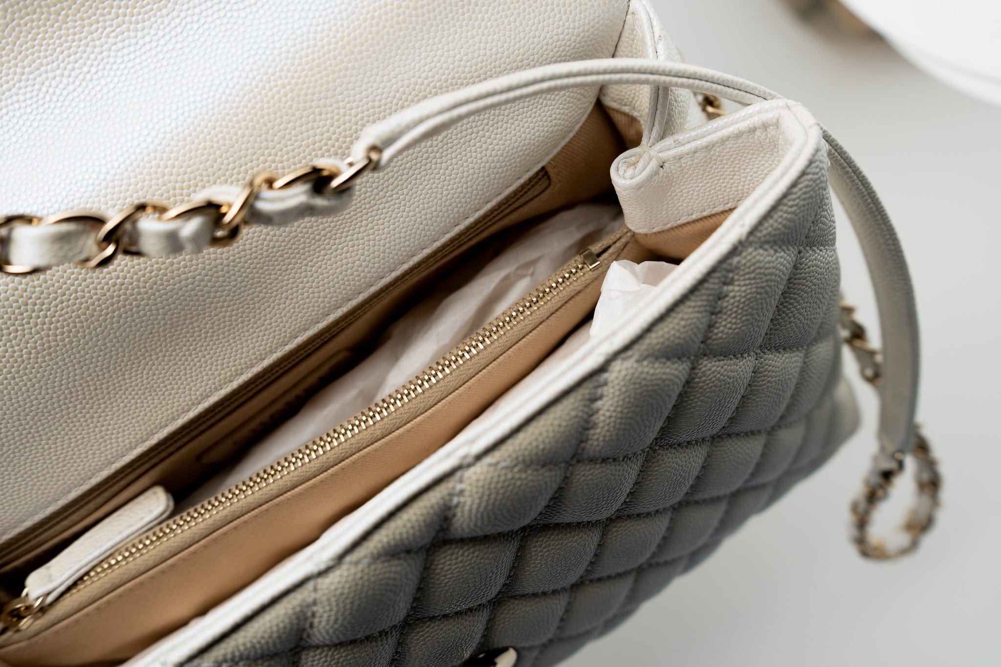 CHANEL Handbag 20K Iridescent White Caviar Quilted Coco Handle Medium Light Gold Hardware - Redeluxe