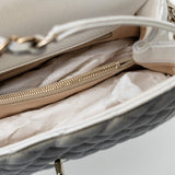 CHANEL Handbag 20K Iridescent White Caviar Quilted Coco Handle Medium Light Gold Hardware - Redeluxe