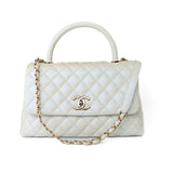 CHANEL Handbag 20K Iridescent White Caviar Quilted Coco Handle Medium Light Gold Hardware - Redeluxe
