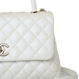 CHANEL Handbag 20K Iridescent White Caviar Quilted Coco Handle Medium Light Gold Hardware - Redeluxe