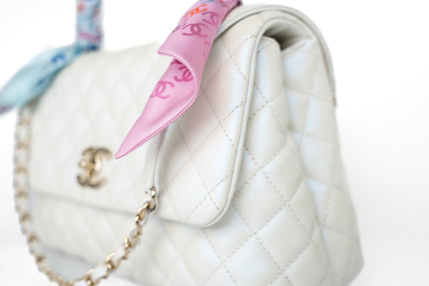 CHANEL Handbag 20K Iridescent White Caviar Quilted Coco Handle Medium Light Gold Hardware - Redeluxe
