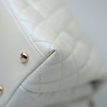 CHANEL Handbag 20K Iridescent White Caviar Quilted Coco Handle Medium Light Gold Hardware - Redeluxe