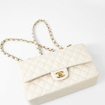 CHANEL Handbag 21A White/ Ivory Caviar Quilted Classic Flap Medium Light Gold Hardware - Redeluxe