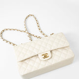 CHANEL Handbag 21A White/ Ivory Caviar Quilted Classic Flap Medium Light Gold Hardware - Redeluxe