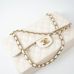 CHANEL Handbag 21A White/ Ivory Caviar Quilted Classic Flap Medium Light Gold Hardware - Redeluxe
