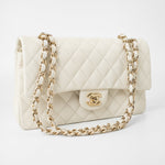 CHANEL Handbag 21A White/ Ivory Caviar Quilted Classic Flap Medium Light Gold Hardware - Redeluxe
