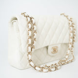 CHANEL Handbag 21A White/ Ivory Caviar Quilted Classic Flap Medium Light Gold Hardware - Redeluxe