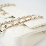 CHANEL Handbag 21A White/ Ivory Caviar Quilted Classic Flap Medium Light Gold Hardware - Redeluxe