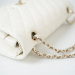 CHANEL Handbag 21A White/ Ivory Caviar Quilted Classic Flap Medium Light Gold Hardware - Redeluxe