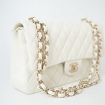 CHANEL Handbag 21A White/ Ivory Caviar Quilted Classic Flap Medium Light Gold Hardware - Redeluxe