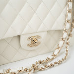 CHANEL Handbag 21A White/ Ivory Caviar Quilted Classic Flap Medium Light Gold Hardware - Redeluxe