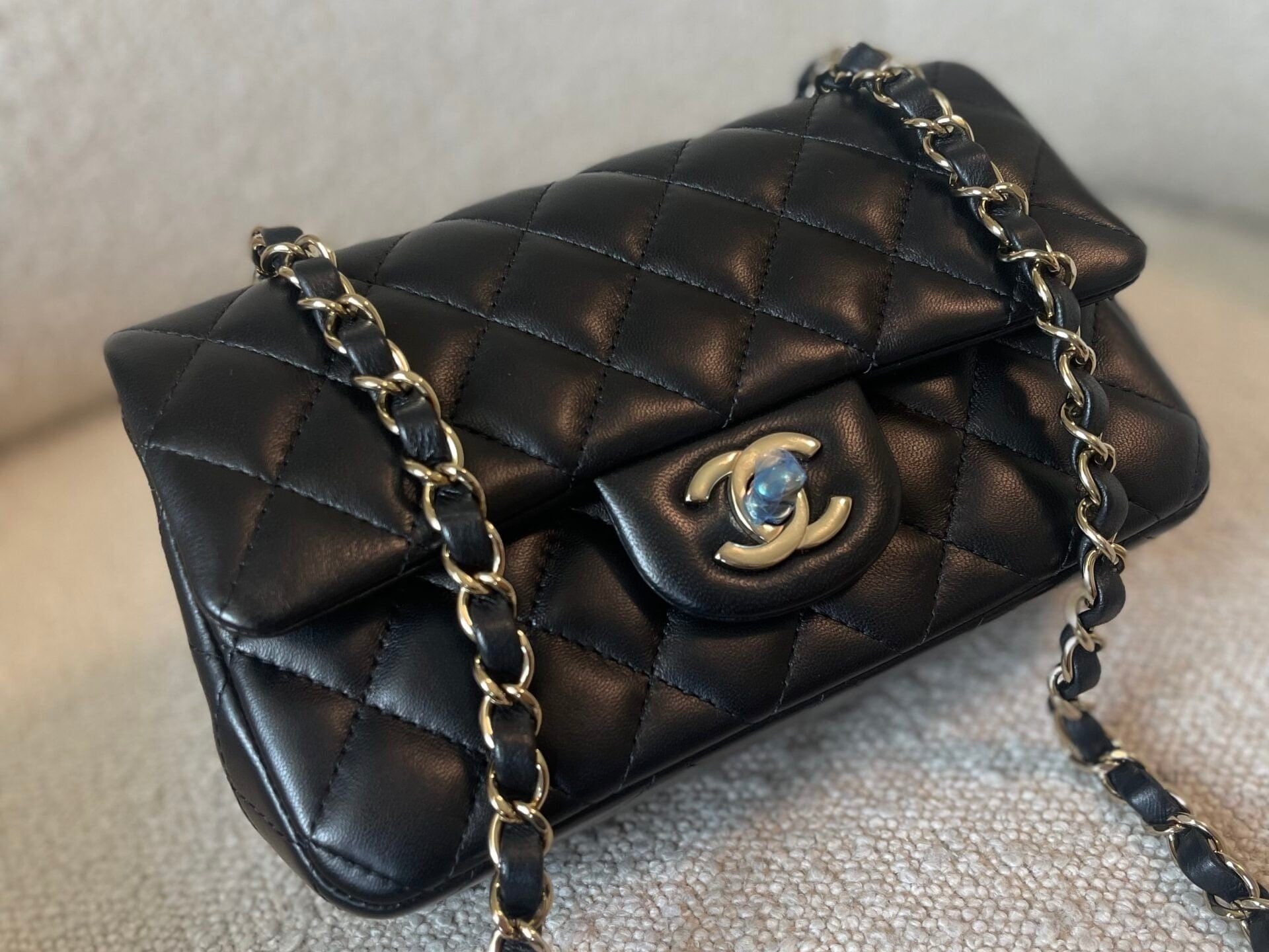 CHANEL Handbag 21K Black Lambskin Quilted Mini Rectangular Single Flap Light Gold Hardware - Redeluxe
