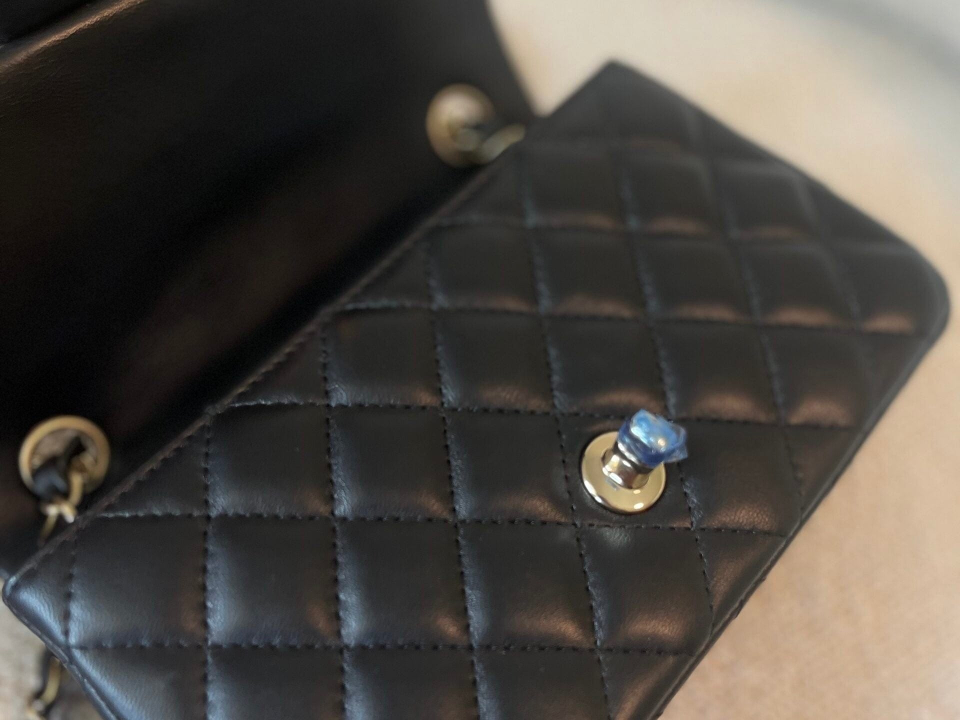 CHANEL Handbag 21K Black Lambskin Quilted Mini Rectangular Single Flap Light Gold Hardware - Redeluxe