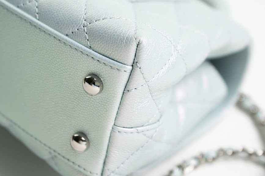 CHANEL Handbag 21K Iridescent Blue Caviar Quilted Coco Handle Small - Redeluxe