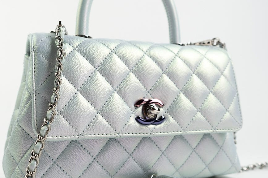 CHANEL Handbag 21K Iridescent Blue Caviar Quilted Coco Handle Small - Redeluxe