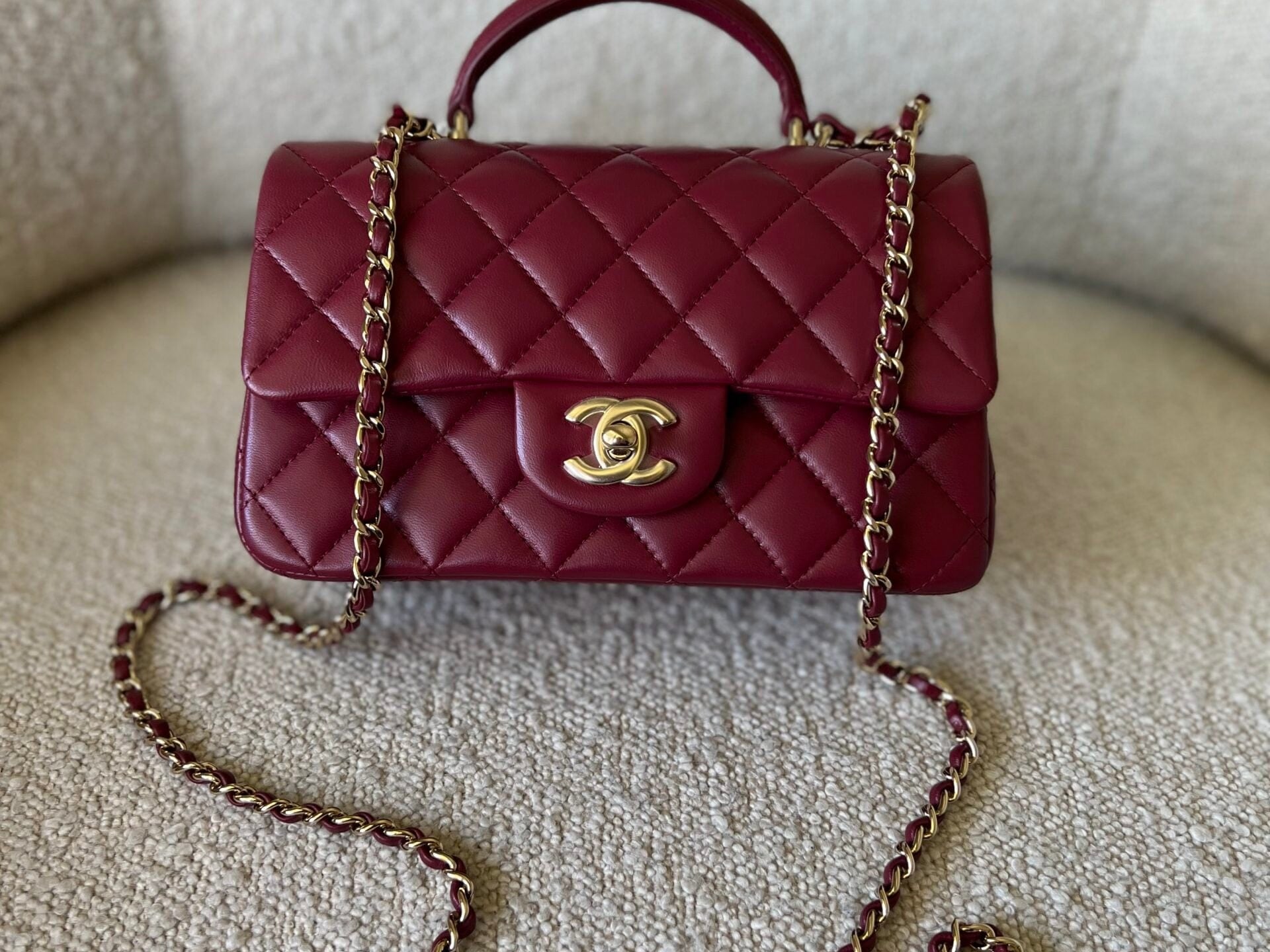 CHANEL Handbag 22A Mini Burgundy Lambskin Quilted Single Flap with Top handle Light Gold Hardware - Redeluxe