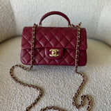 CHANEL Handbag 22A Mini Burgundy Lambskin Quilted Single Flap with Top handle Light Gold Hardware - Redeluxe