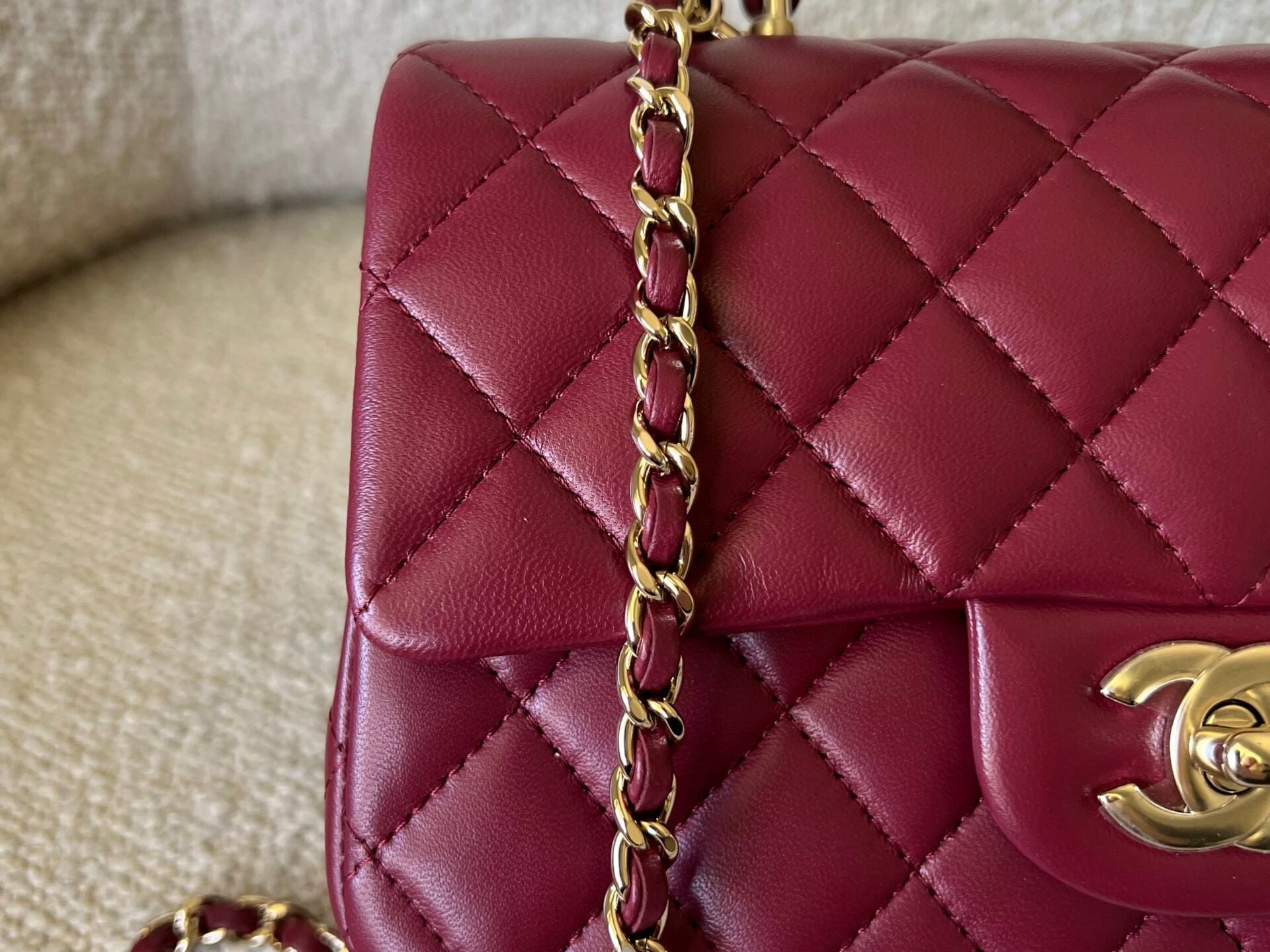 CHANEL Handbag 22A Mini Burgundy Lambskin Quilted Single Flap with Top handle Light Gold Hardware - Redeluxe