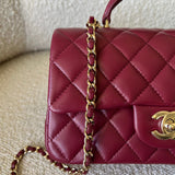 CHANEL Handbag 22A Mini Burgundy Lambskin Quilted Single Flap with Top handle Light Gold Hardware - Redeluxe