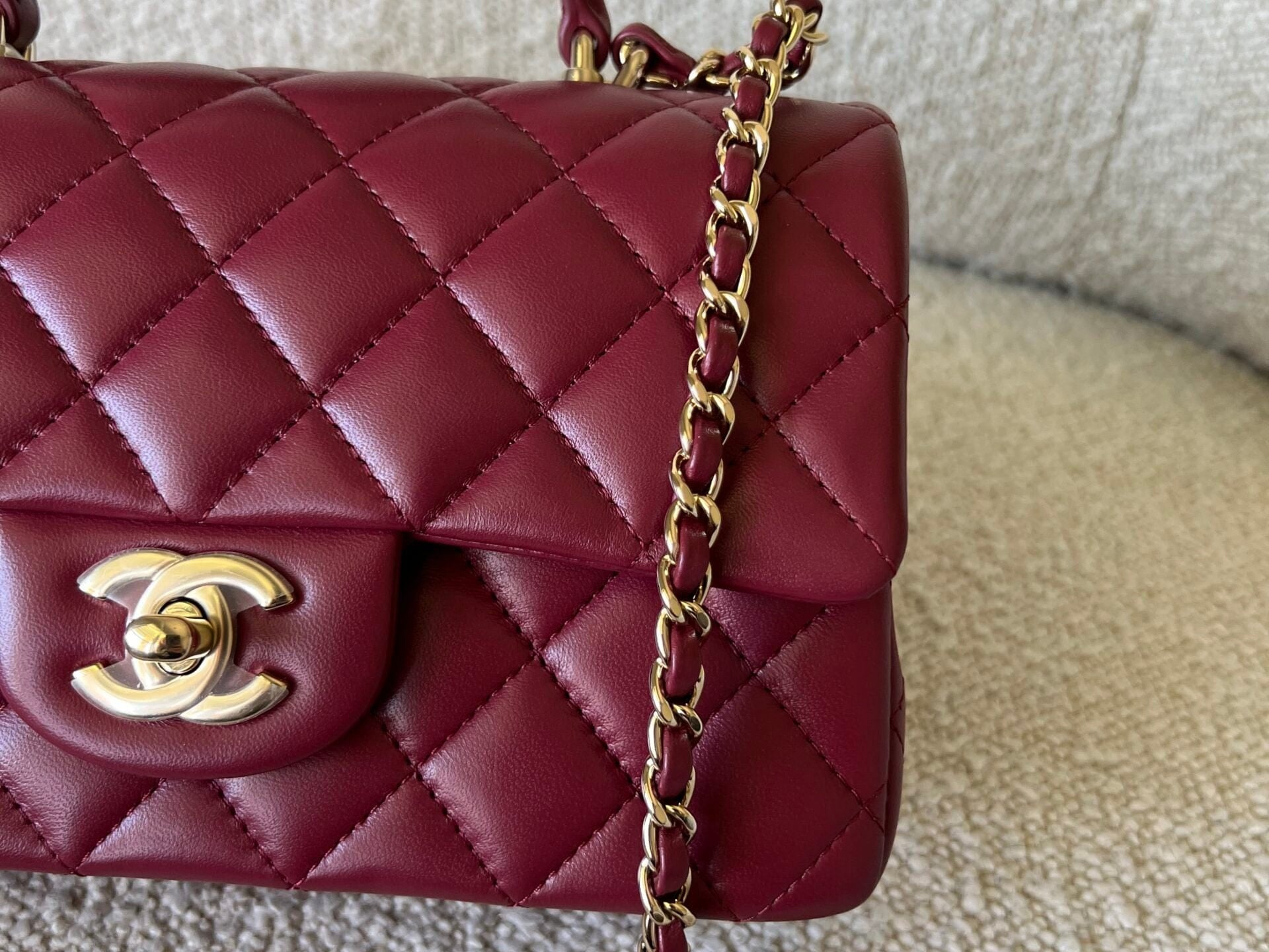 CHANEL Handbag 22A Mini Burgundy Lambskin Quilted Single Flap with Top handle Light Gold Hardware - Redeluxe