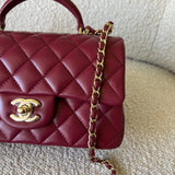 CHANEL Handbag 22A Mini Burgundy Lambskin Quilted Single Flap with Top handle Light Gold Hardware - Redeluxe