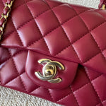 CHANEL Handbag 22A Mini Burgundy Lambskin Quilted Single Flap with Top handle Light Gold Hardware - Redeluxe