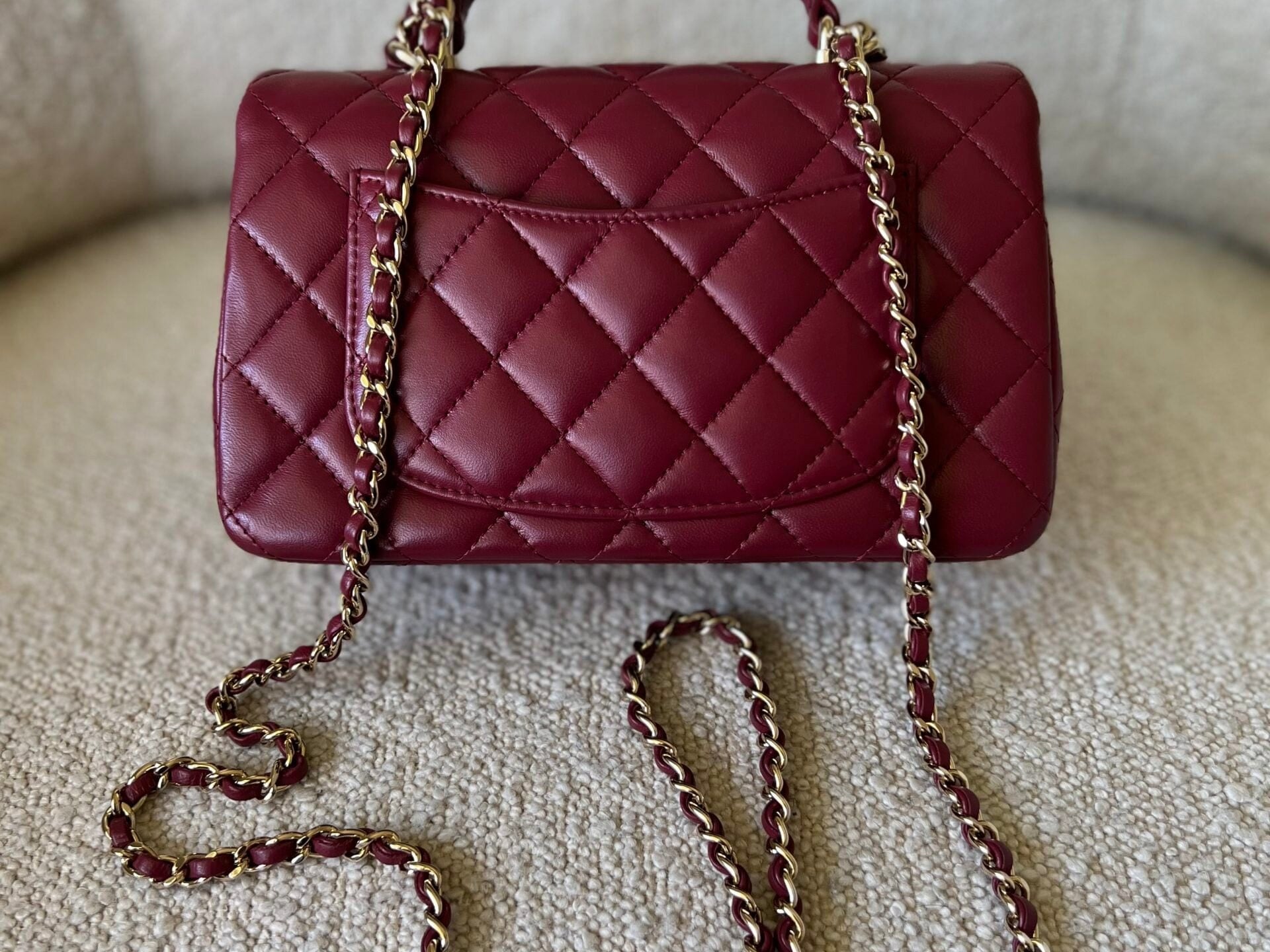 CHANEL Handbag 22A Mini Burgundy Lambskin Quilted Single Flap with Top handle Light Gold Hardware - Redeluxe