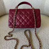 CHANEL Handbag 22A Mini Burgundy Lambskin Quilted Single Flap with Top handle Light Gold Hardware - Redeluxe