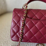 CHANEL Handbag 22A Mini Burgundy Lambskin Quilted Single Flap with Top handle Light Gold Hardware - Redeluxe