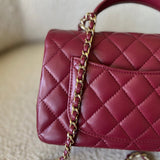 CHANEL Handbag 22A Mini Burgundy Lambskin Quilted Single Flap with Top handle Light Gold Hardware - Redeluxe