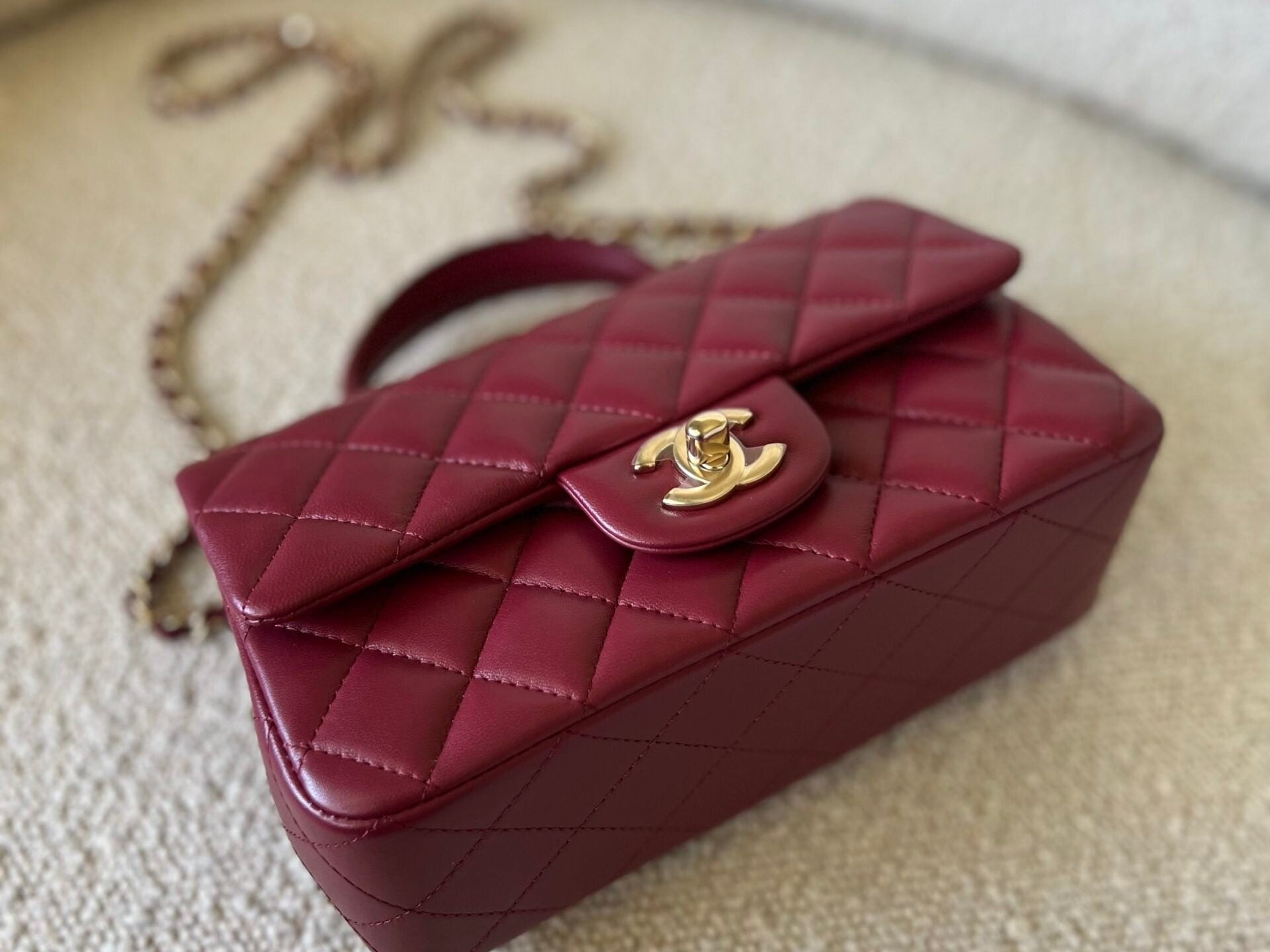 CHANEL Handbag 22A Mini Burgundy Lambskin Quilted Single Flap with Top handle Light Gold Hardware - Redeluxe