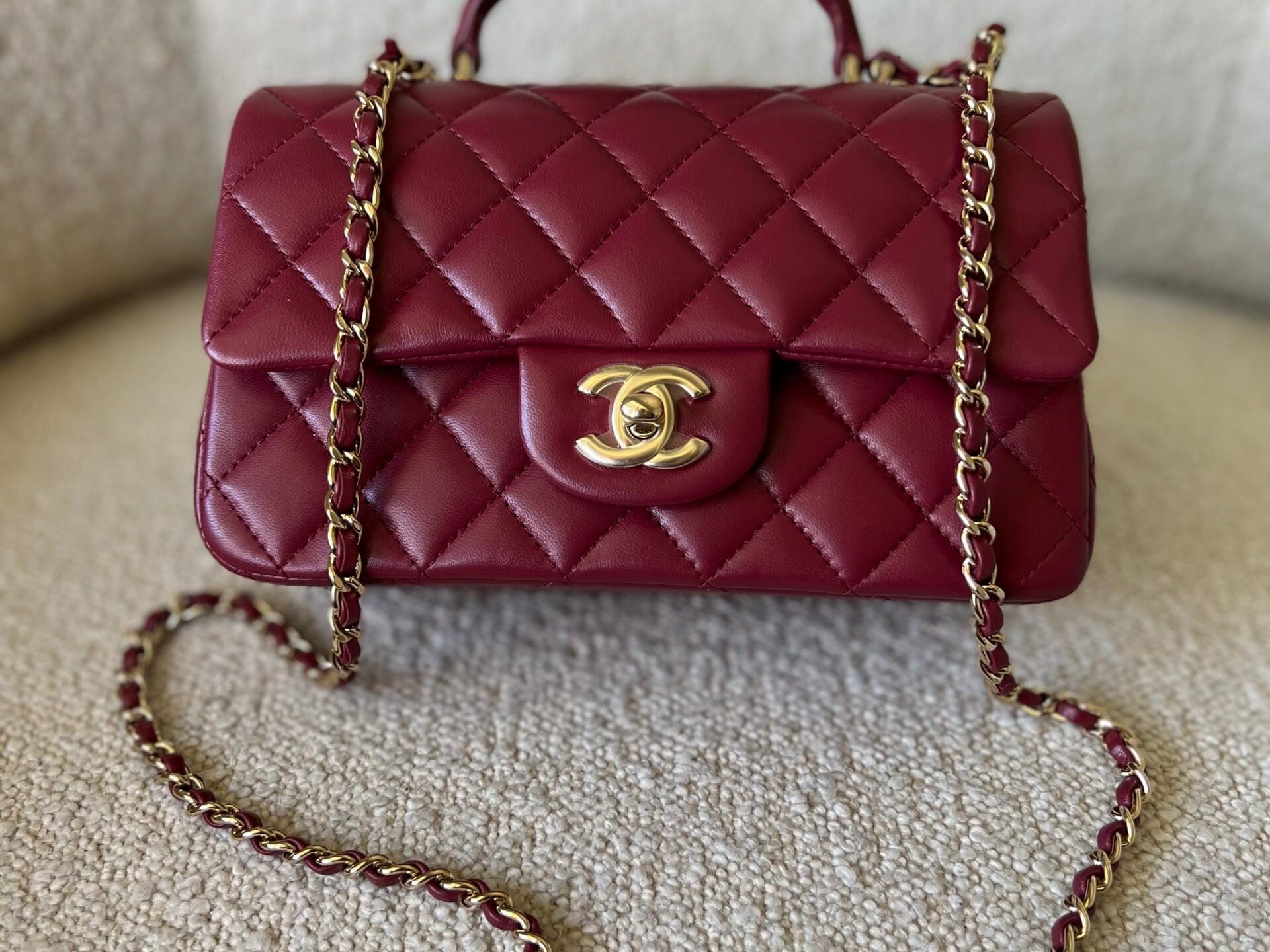 CHANEL Handbag 22A Mini Burgundy Lambskin Quilted Single Flap with Top handle Light Gold Hardware - Redeluxe