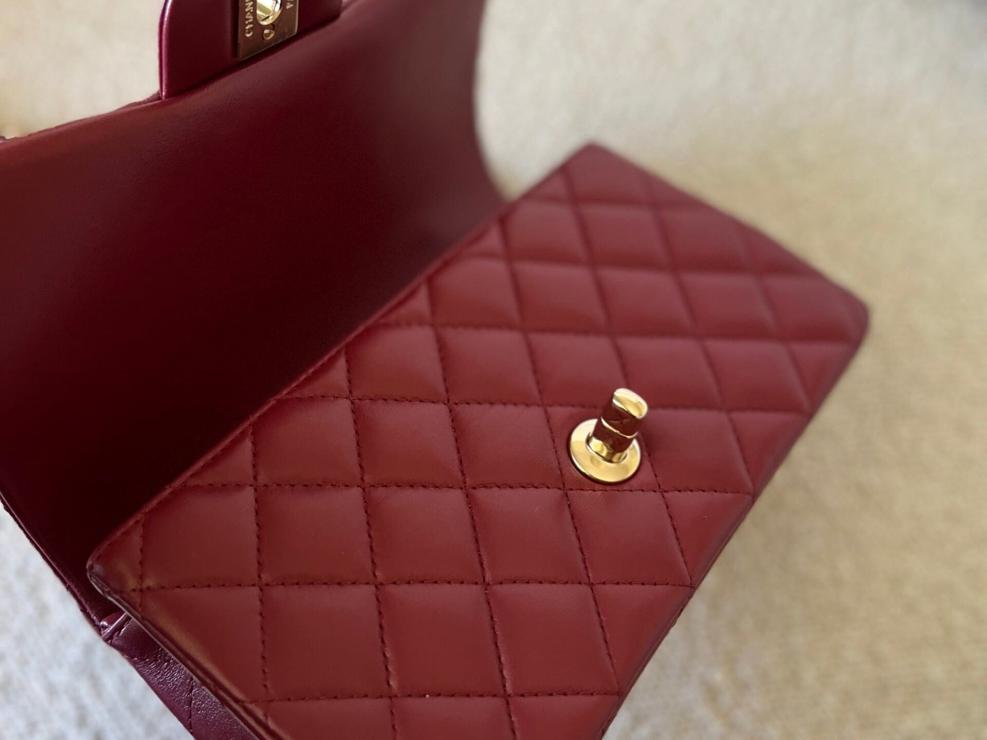CHANEL Handbag 22A Mini Burgundy Lambskin Quilted Single Flap with Top handle Light Gold Hardware - Redeluxe
