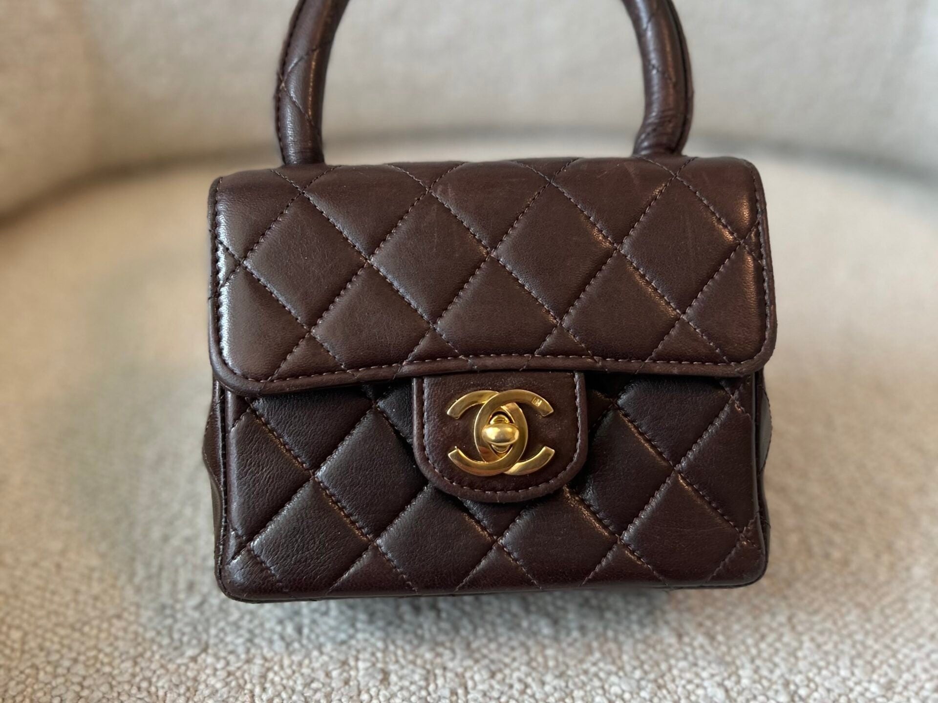 CHANEL Handbag Brown Vintage Brown Lambskin Quilted Micro Mini Kelly with Top Handle GHW - Redeluxe