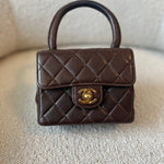 CHANEL Handbag Brown Vintage Brown Lambskin Quilted Micro Mini Kelly with Top Handle GHW - Redeluxe