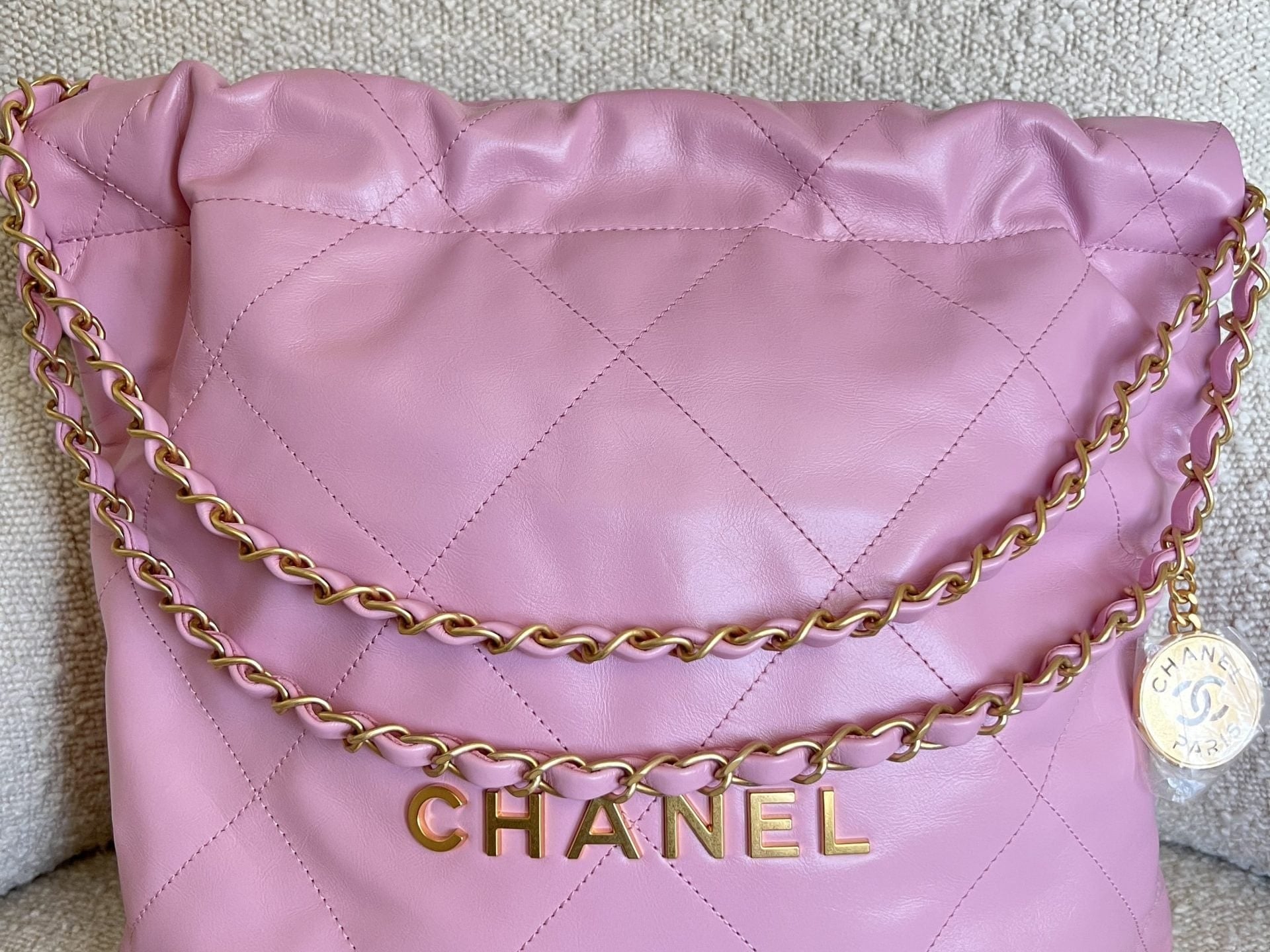 CHANEL Handbag Chanel 22 Pink Shiny Calfskin Quilted Drawstring Bag Small GHW - Redeluxe