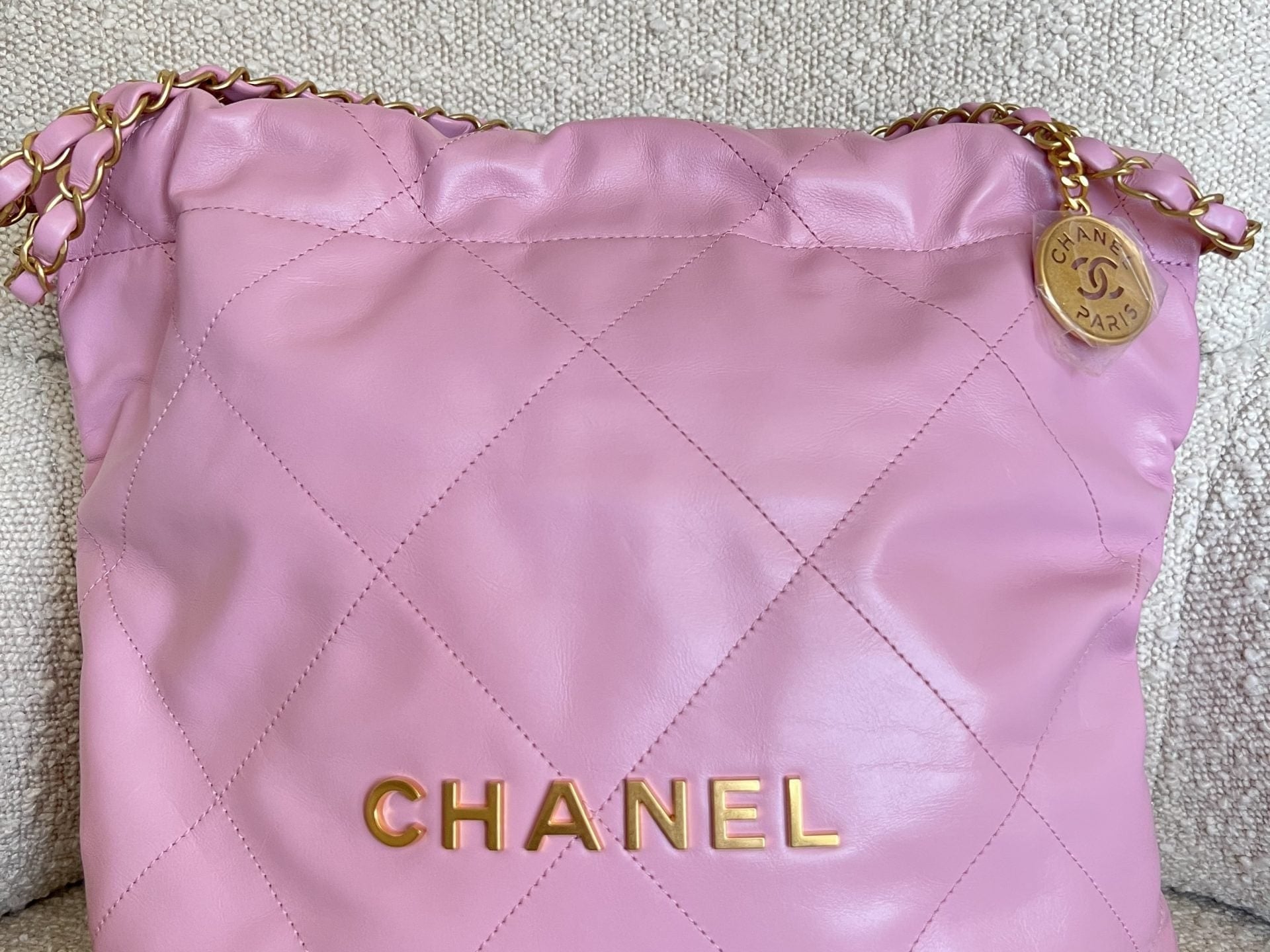 CHANEL Handbag Chanel 22 Pink Shiny Calfskin Quilted Drawstring Bag Small GHW - Redeluxe